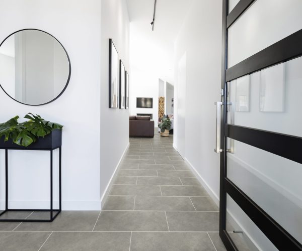 Contemporary home entry hall with polished concrete floors